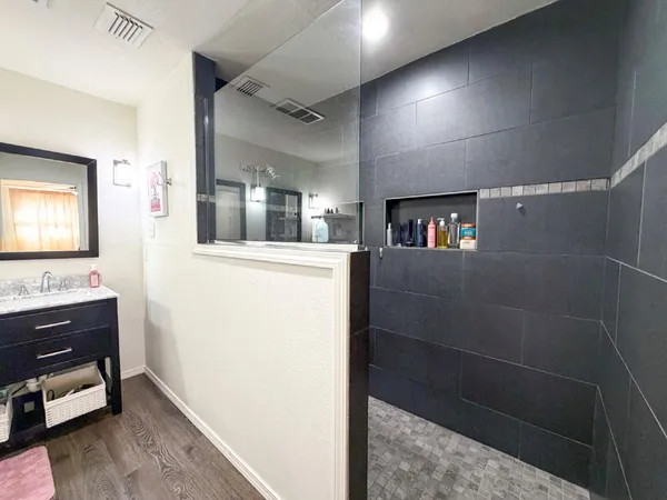 a bathroom with a sink and a mirror