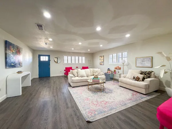 a view of a dining room with furniture and wooden floor