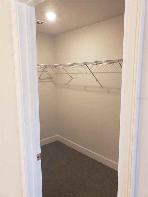 4858 Sutherland St Spring Hill, Unit LOT 61 Spring Hill, FL 34609 - Photo 15 of 15 a view of a room with racks on the wall