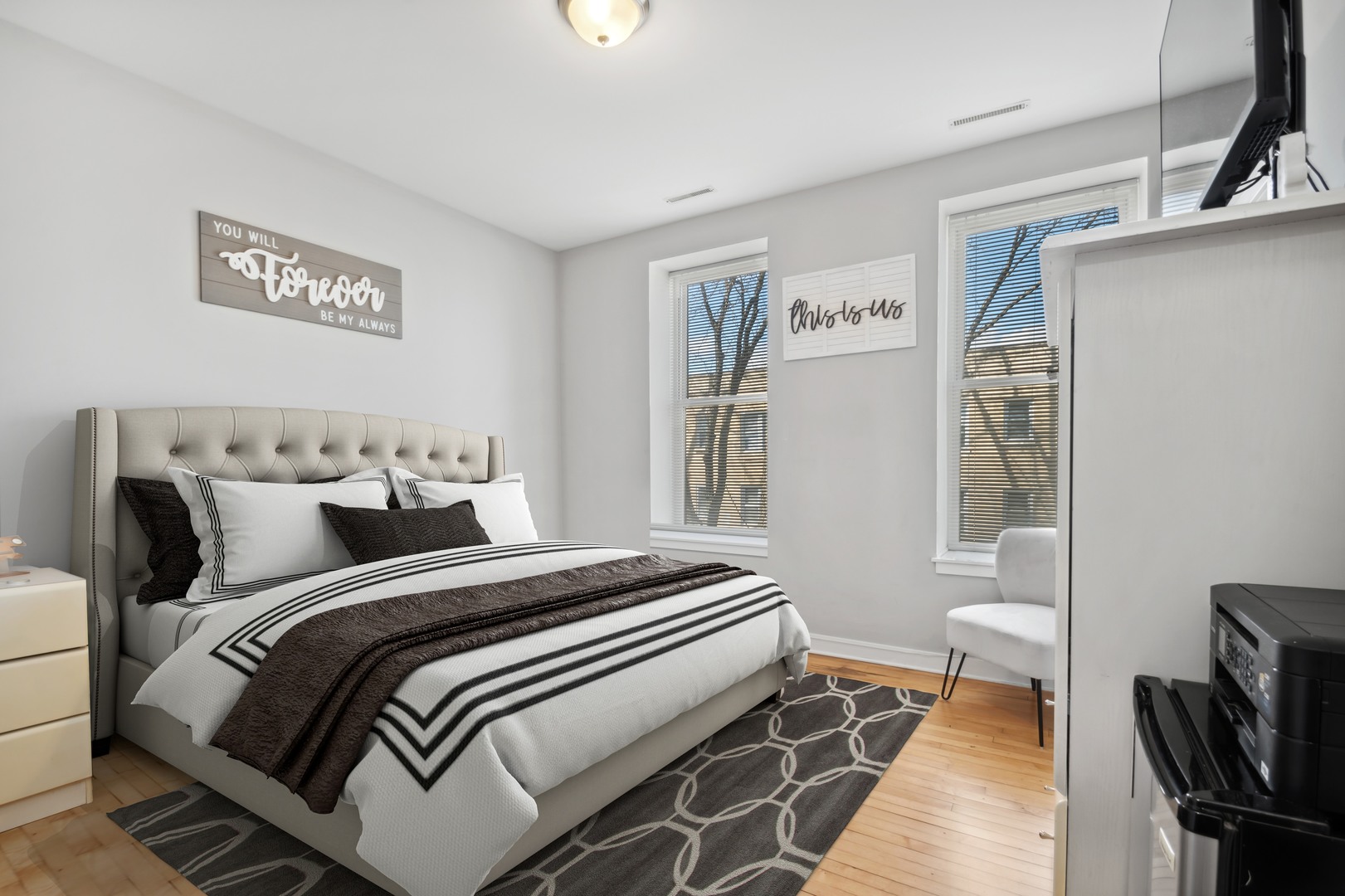 2458 North Lotus Avenue Chicago, IL 60639 - Photo 11 of 22 a bedroom with a bed and wooden floor