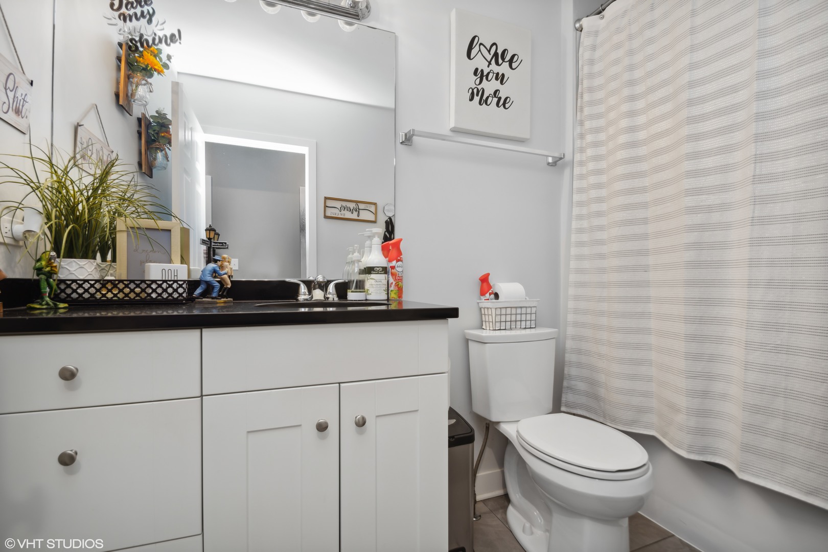 2458 North Lotus Avenue Chicago, IL 60639 - Photo 12 of 22 a bathroom with a toilet sink and mirror