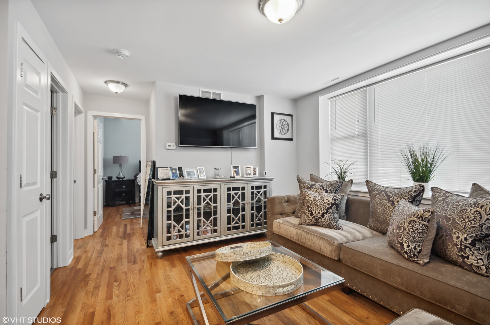 2458 North Lotus Avenue Chicago, IL 60639 - Photo 13 of 22 a living room with furniture and a flat screen tv