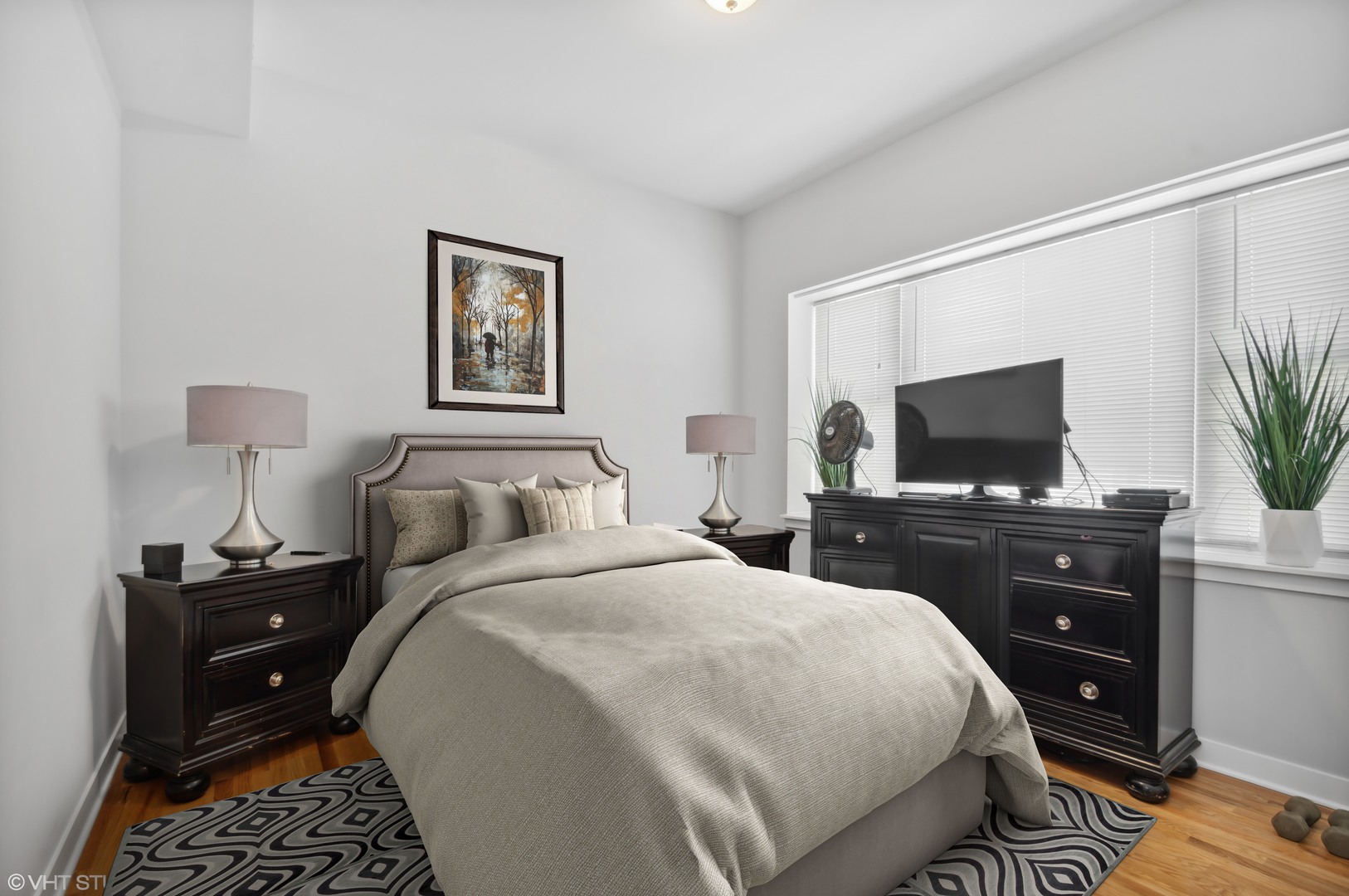 2458 North Lotus Avenue Chicago, IL 60639 - Photo 15 of 22 a bedroom with a bed and a flat screen tv