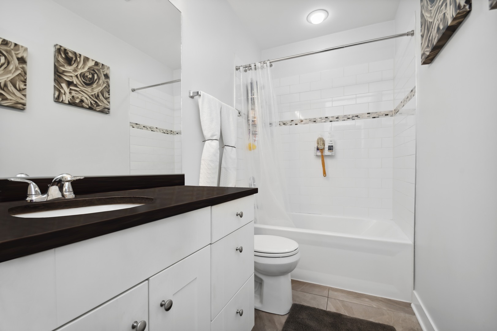 2458 North Lotus Avenue Chicago, IL 60639 - Photo 16 of 22 a bathroom with a granite countertop sink a toilet and shower