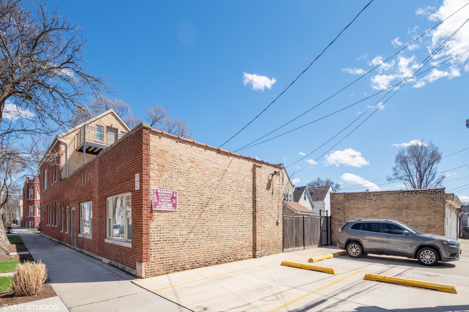 2458 North Lotus Avenue Chicago, IL 60639 - Photo 2 of 22 a car parked on the side of a street
