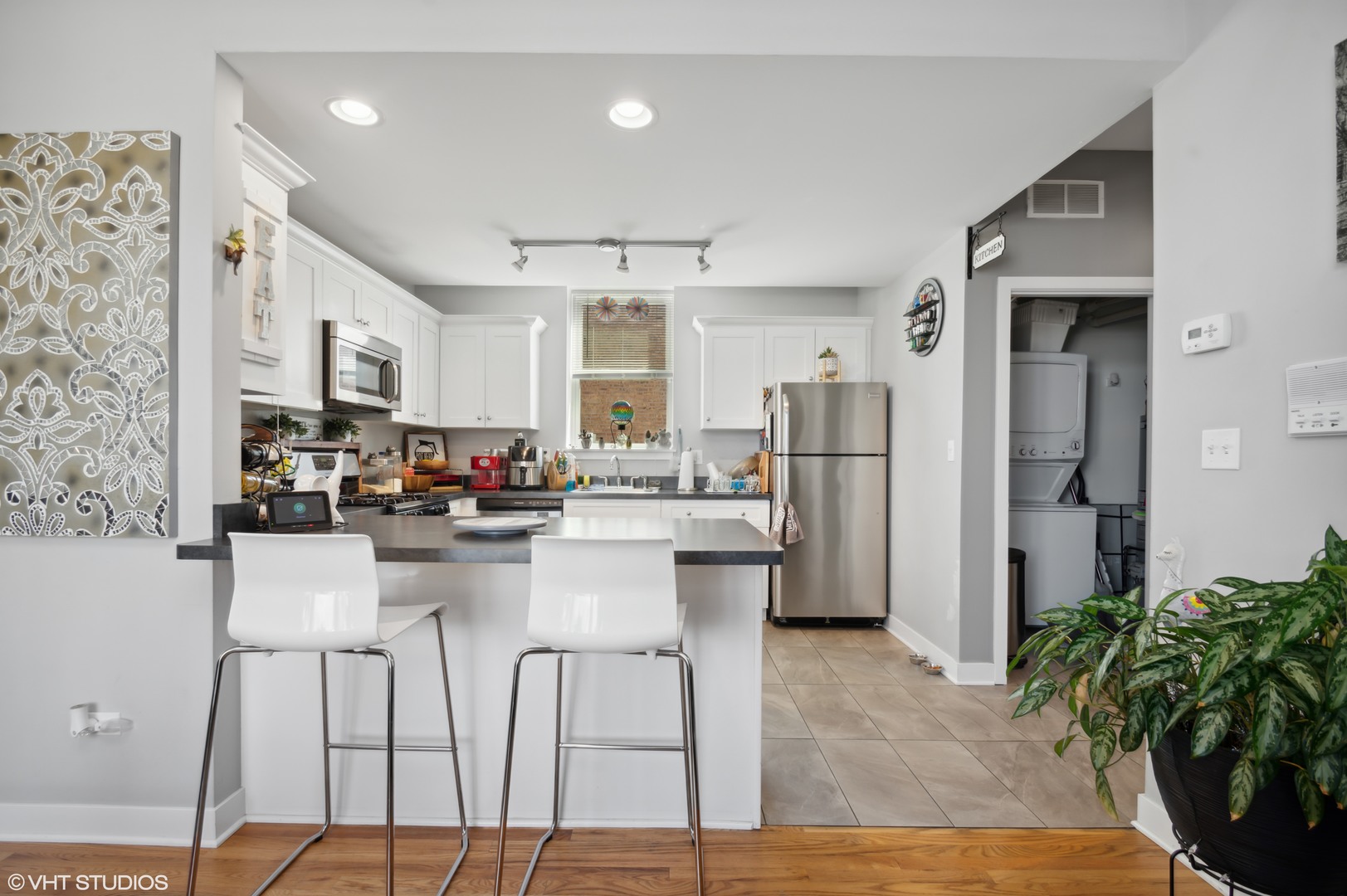 2458 North Lotus Avenue Chicago, IL 60639 - Photo 7 of 22 a kitchen with refrigerator and cabinets