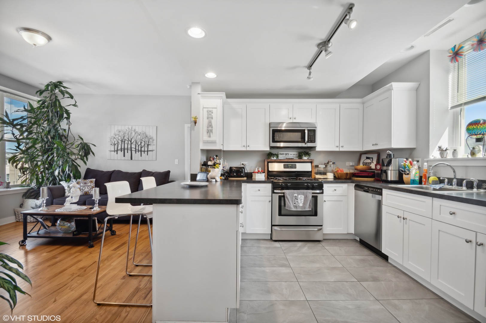 2458 North Lotus Avenue Chicago, IL 60639 - Photo 8 of 22 a kitchen with stainless steel appliances granite countertop a sink and cabinets