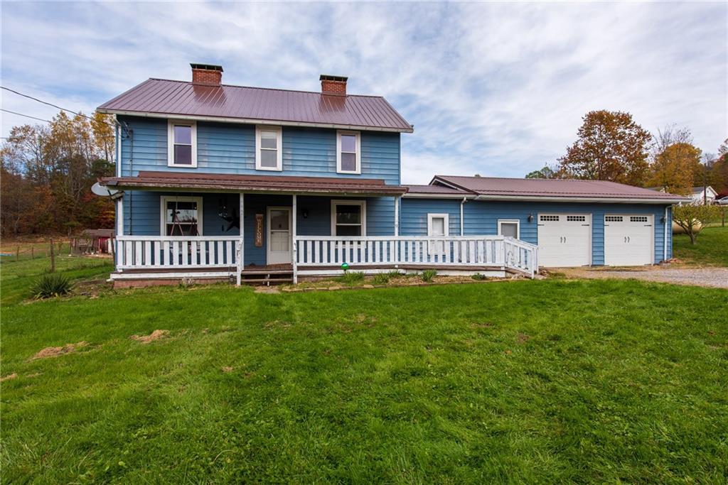 1182 State Rte 1035 Templeton, PA 16259 - Photo 1 of 50 a front view of a house with a garden