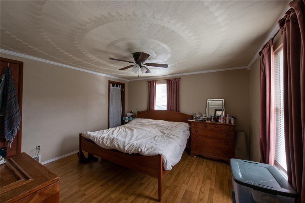 1182 State Rte 1035 Templeton, PA 16259 - Photo 26 of 50 a bedroom with a bed and a dresser with wooden floor