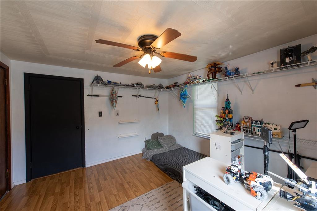 1182 State Rte 1035 Templeton, PA 16259 - Photo 33 of 50 a bedroom with a bed and a chandelier