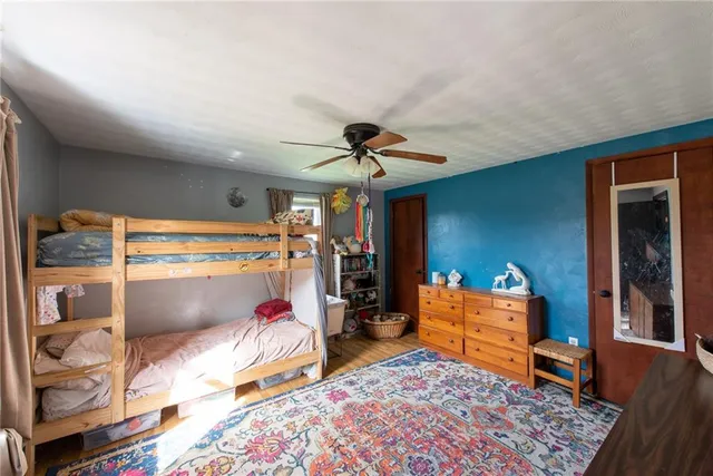 a bed room with a bed and a window