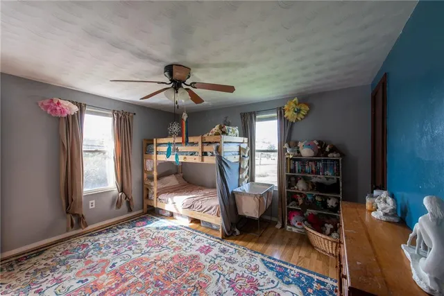 a living room with furniture a rug and a window