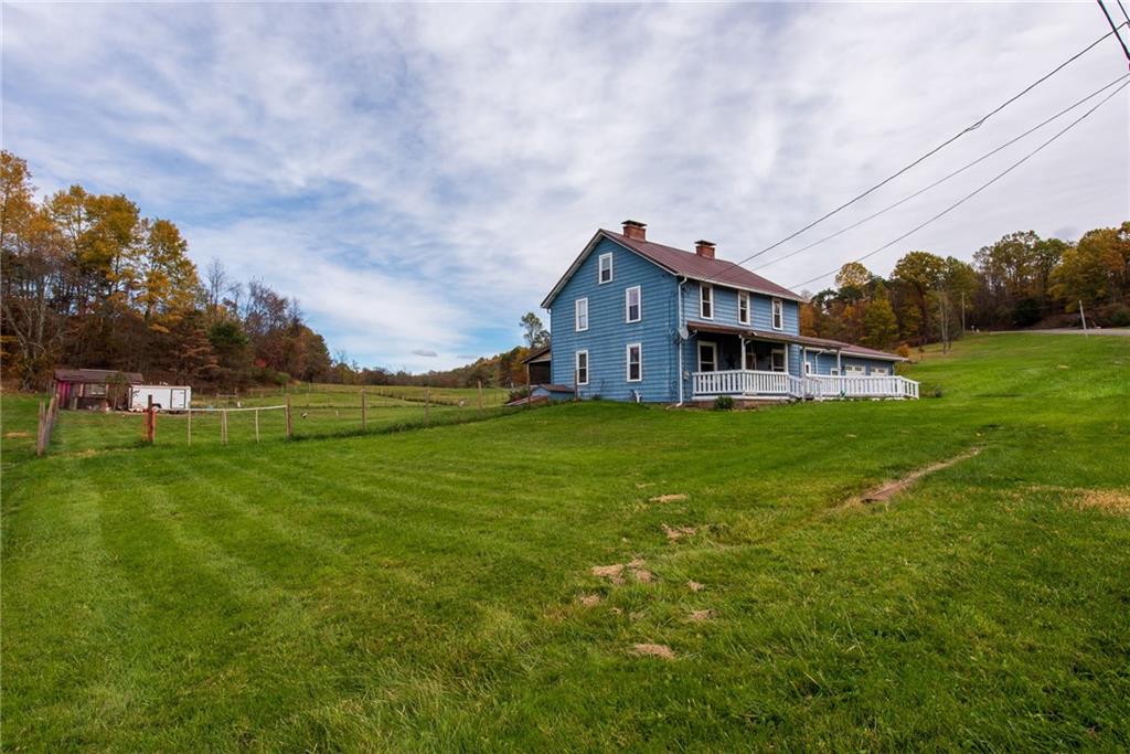 1182 State Rte 1035 Templeton, PA 16259 - Photo 37 of 50 a front view of a house with garden