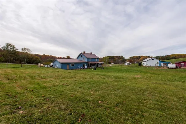 a view of a house with a big yard