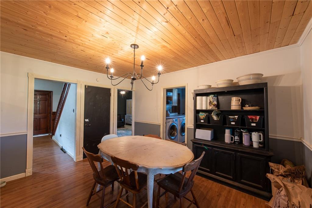 1182 State Rte 1035 Templeton, PA 16259 - Photo 8 of 50 a view of a dining room with furniture and wooden floor
