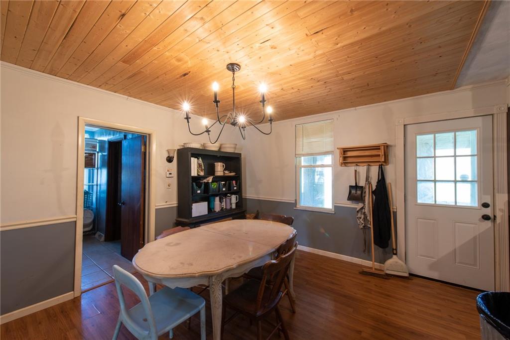 1182 State Rte 1035 Templeton, PA 16259 - Photo 9 of 50 a view of a dining room with furniture and wooden floor