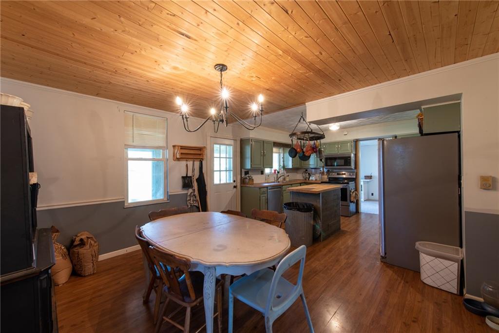 1182 State Rte 1035 Templeton, PA 16259 - Photo 10 of 50 a view of a dining room with furniture and wooden floor