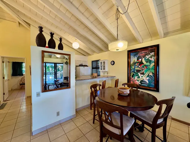 a outdoor space with lots of tables a garden view and a couch