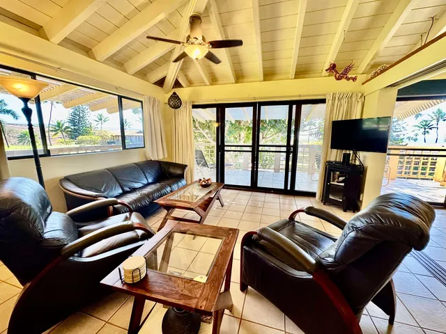 a living room with lots of furniture and a flat screen tv