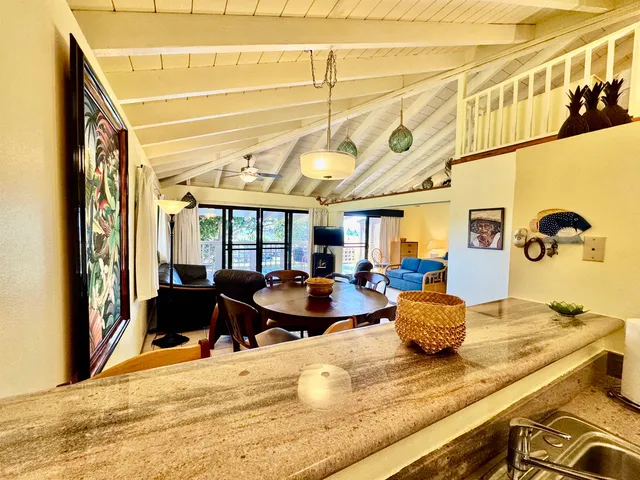 a kitchen that has a sink and a stove