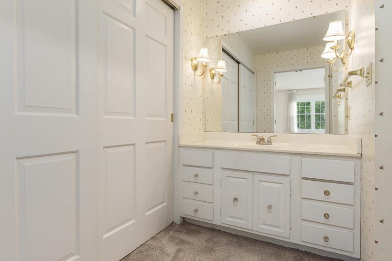 5792 Haddon Place Rockford, IL 61114 - Photo 30 of 47 a bathroom with a sink and a mirror