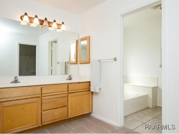 5732 Columbine Road Prescott, AZ 86305 - Photo 13 of 24 a spacious bathroom with a double vanity sink and a mirror