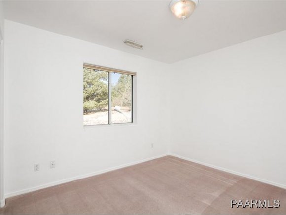 5732 Columbine Road Prescott, AZ 86305 - Photo 17 of 24 a view of an empty room with a window