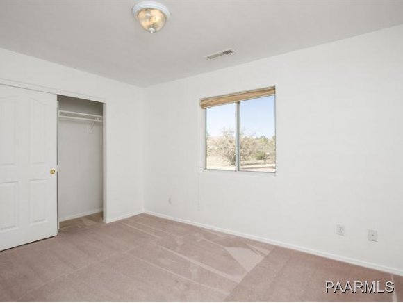 5732 Columbine Road Prescott, AZ 86305 - Photo 18 of 24 a view of an empty room with a window