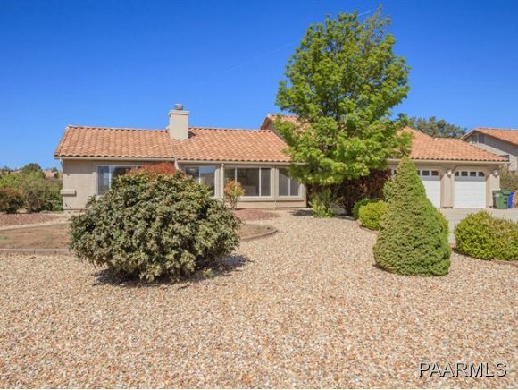 5732 Columbine Road Prescott, AZ 86305 - Photo 2 of 24 a front view of a house with a garden