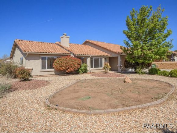 5732 Columbine Road Prescott, AZ 86305 - Photo 3 of 24 a front view of a house with a garden