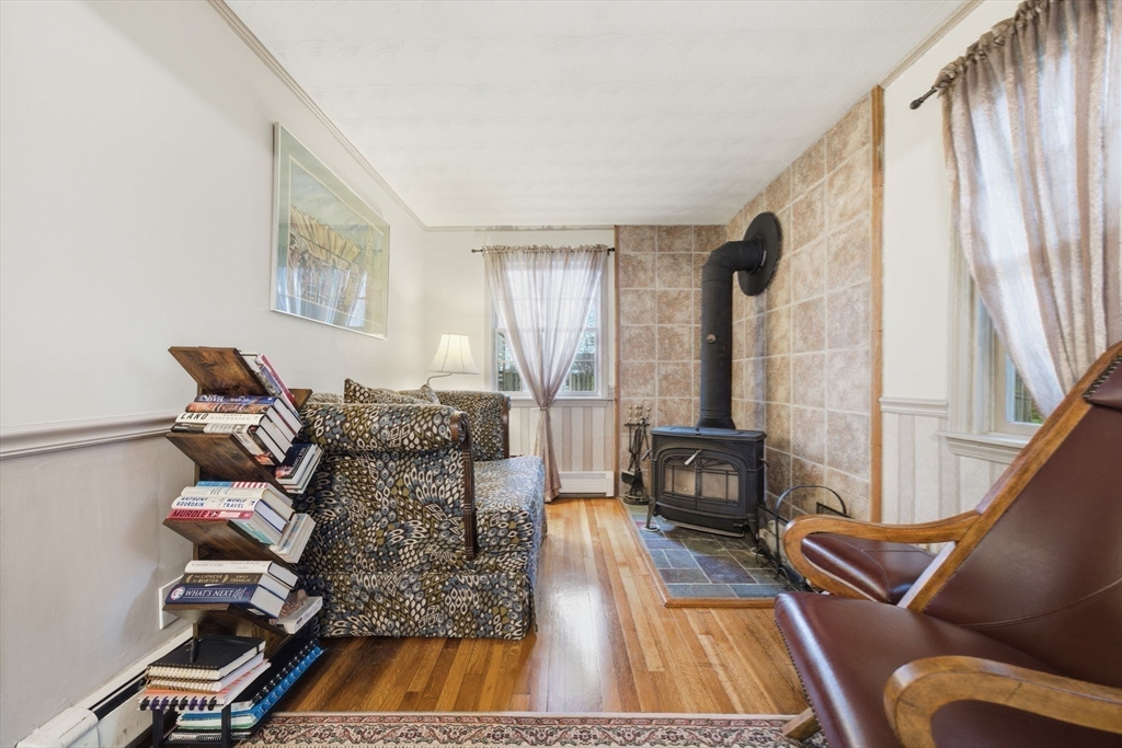 4 Laurel Street Woburn, MA 01801 - Photo 15 of 40 a living room with furniture and wooden floor