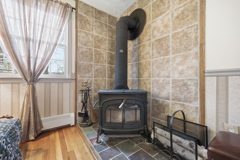 4 Laurel Street Woburn, MA 01801 - Photo 16 of 40 a bathroom with a sink and a mirror