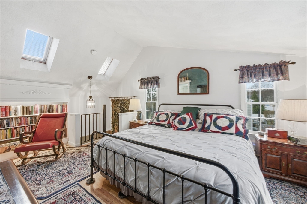 4 Laurel Street Woburn, MA 01801 - Photo 22 of 40 a bedroom with a bed a couch and dresser