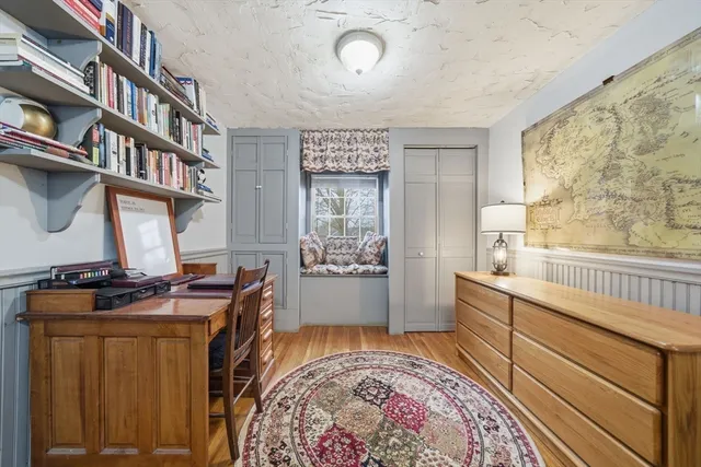 a bedroom with furniture and a window