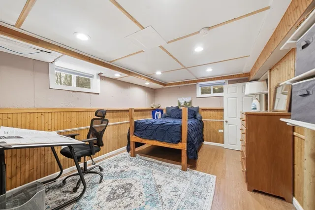 a view of a livingroom with furniture and a workspace