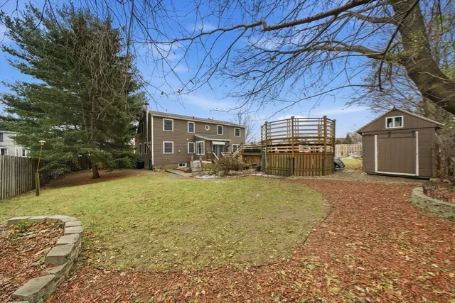 a view of a backyard of the house