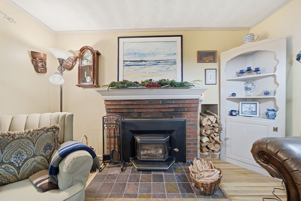 4 Laurel Street Woburn, MA 01801 - Photo 7 of 40 a living room with furniture and a fireplace