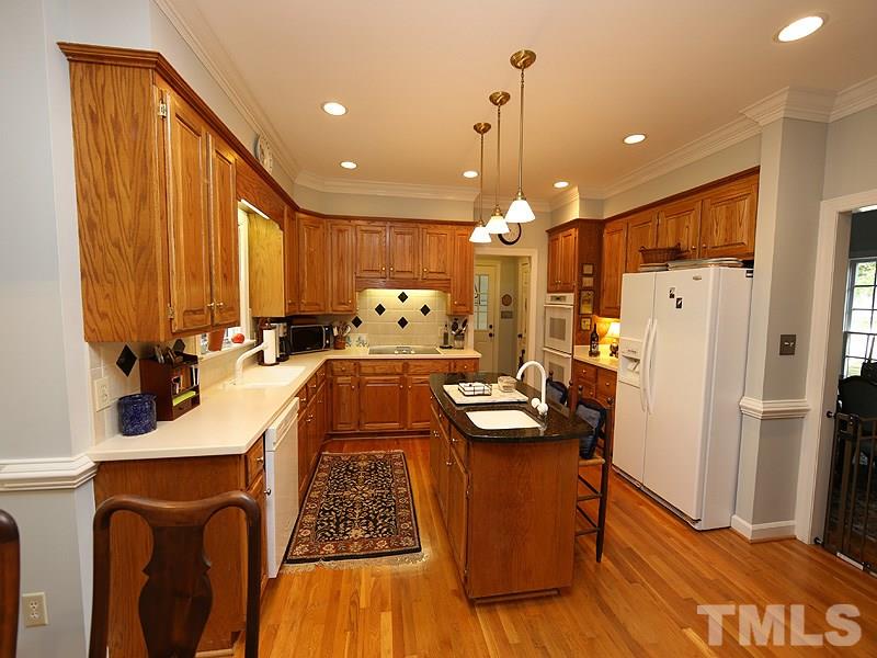 321 Jellison Court Raleigh, NC 27615 - Photo 8 of 24 Granite on the Island, Solid Surface on the rest of counters