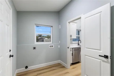 a view of an empty room with a cabinet