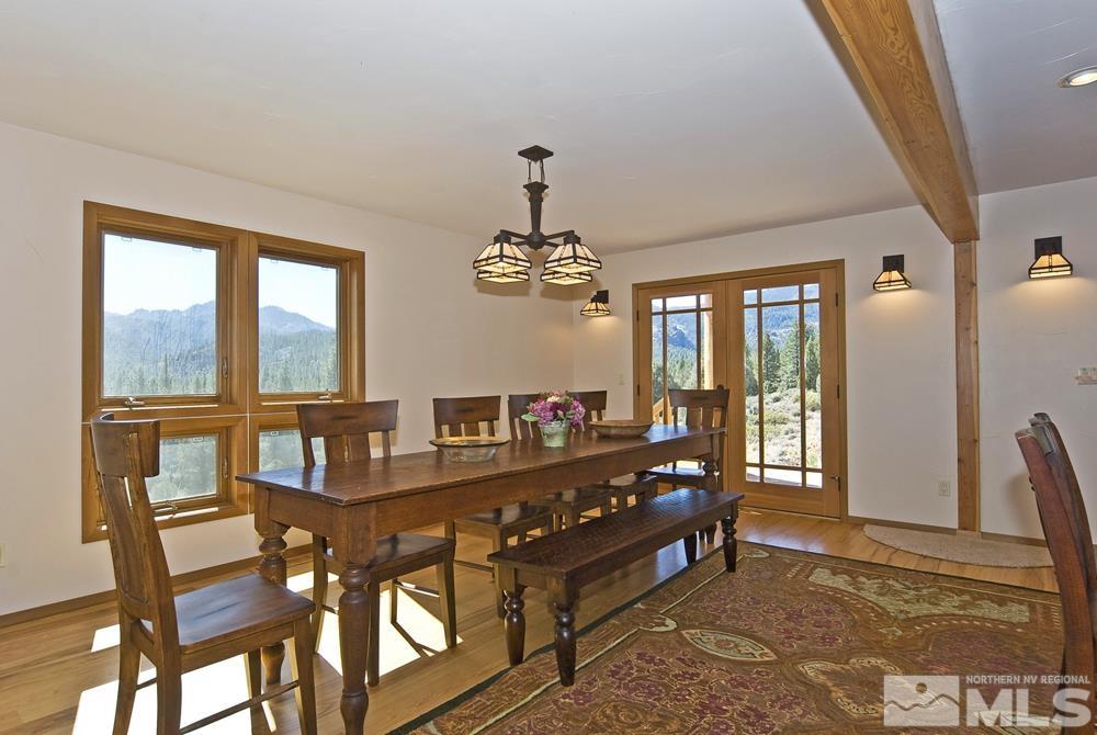 650 Raymond View Road Markleeville, CA 96120 - Photo 16 of 37 a view of a dining room with furniture and chandelier
