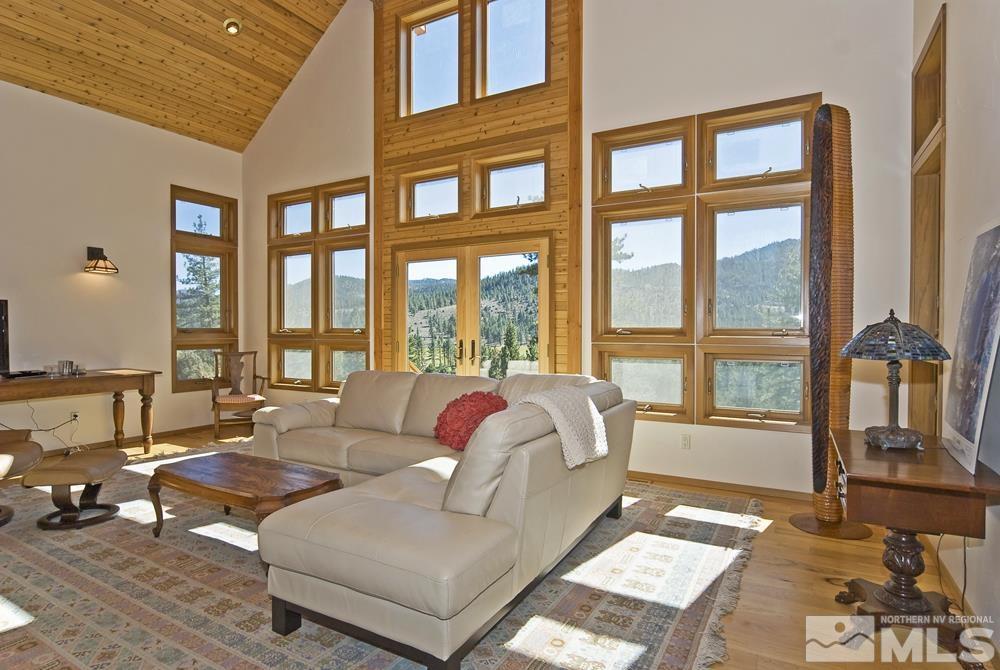 650 Raymond View Road Markleeville, CA 96120 - Photo 22 of 37 a living room with furniture and a floor to ceiling window