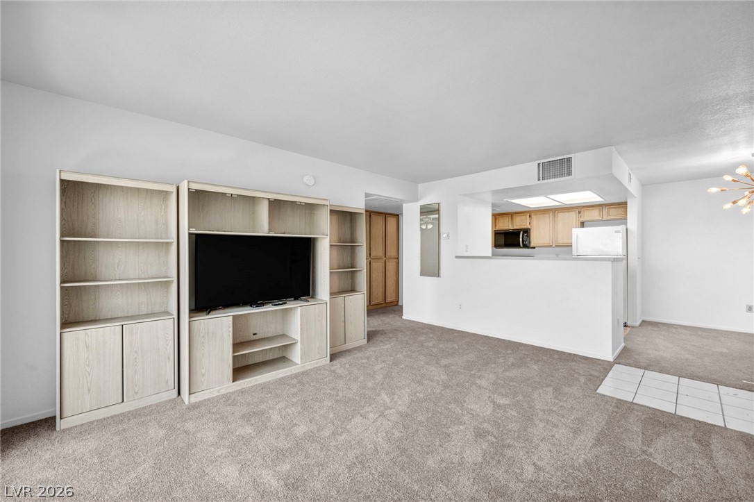 8070 West Russell Road, Unit 2060 Las Vegas, NV 89113 - Photo 24 of 47 This living room provides a comfortable setting for everyday living and entertaining.