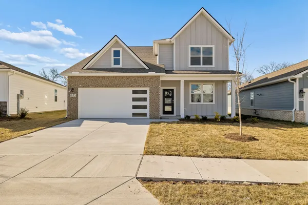 a front view of a house with a garage