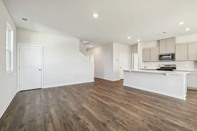 a view of kitchen with wooden floor