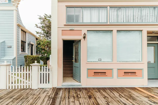 a view of a house with a door and wooden floor