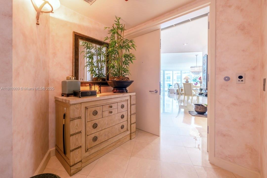 2127 Brickell Avenue, Unit 3304 Miami, FL 33129 - Photo 15 of 39 a bathroom with a double vanity sink toilet and shower