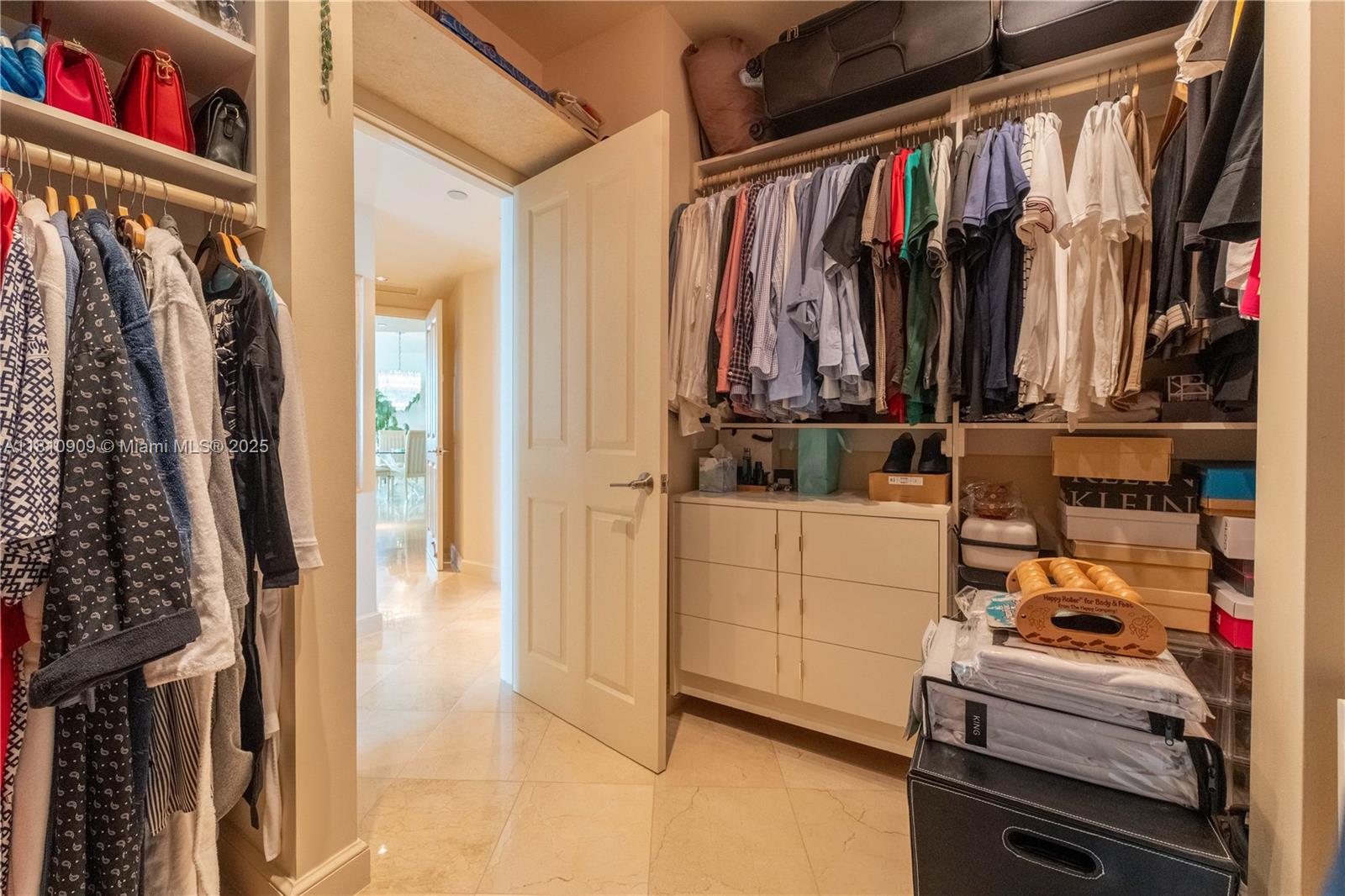 2127 Brickell Avenue, Unit 3304 Miami, FL 33129 - Photo 22 of 39 a view of walk in closet with clothes and shoes