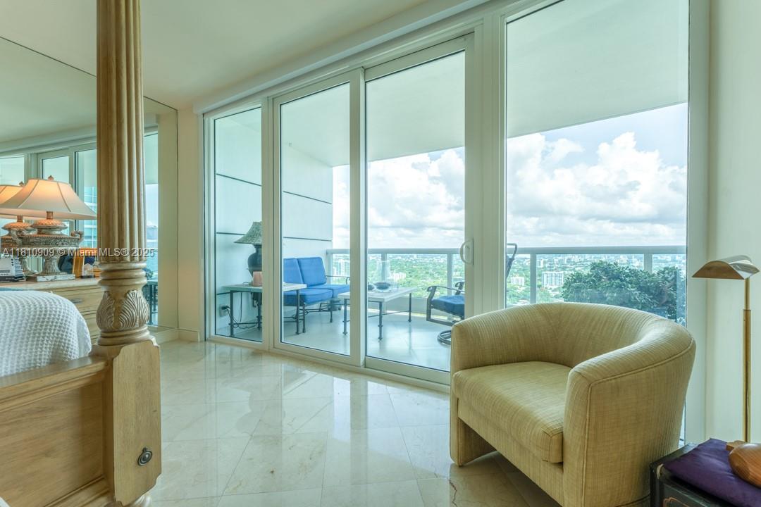 2127 Brickell Avenue, Unit 3304 Miami, FL 33129 - Photo 25 of 39 a living room with furniture and a large window