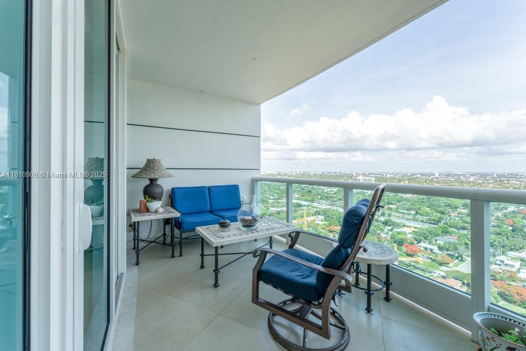 2127 Brickell Avenue, Unit 3304 Miami, FL 33129 - Photo 26 of 39 a living room with furniture a rug and a large window