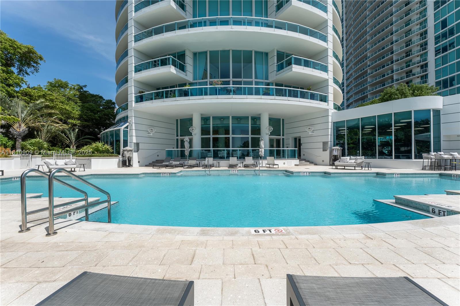 2127 Brickell Avenue, Unit 3304 Miami, FL 33129 - Photo 30 of 39 a front view of a building with a garden